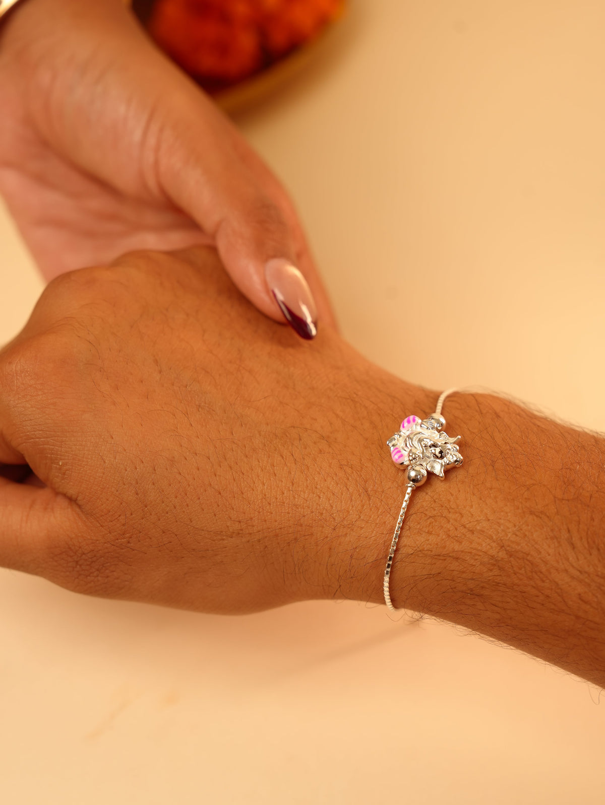 Silver Ganesha Chain Bracelet Rakhi - Pink Accent